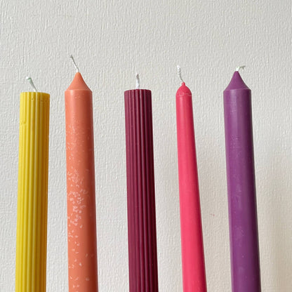La Bouqe colorful taper candles for dinner table in yellow orange burgundy pink and purple