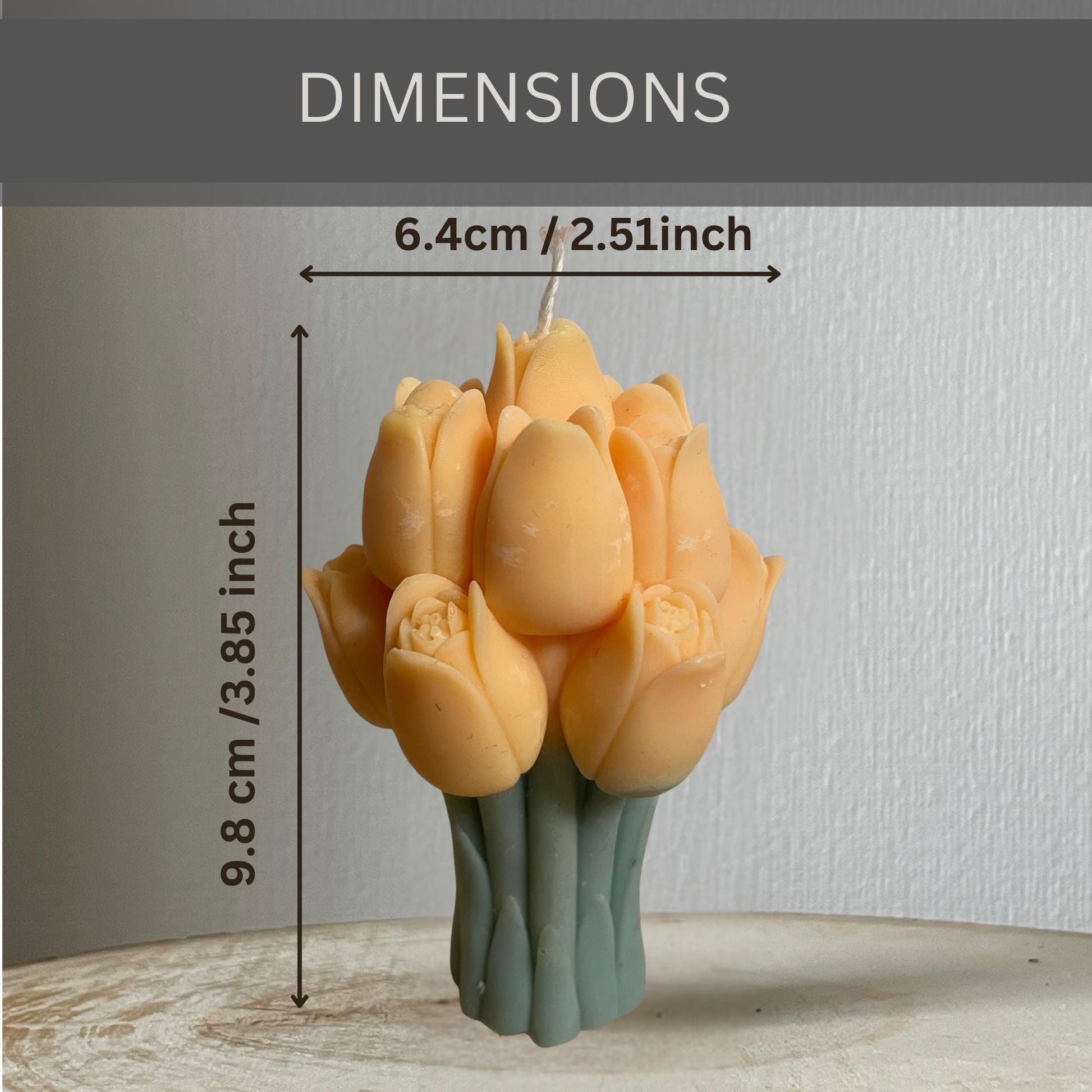La Bouqe tulip bouquet candle with orange tulip petals and green stems measuring 3.85 inches tall