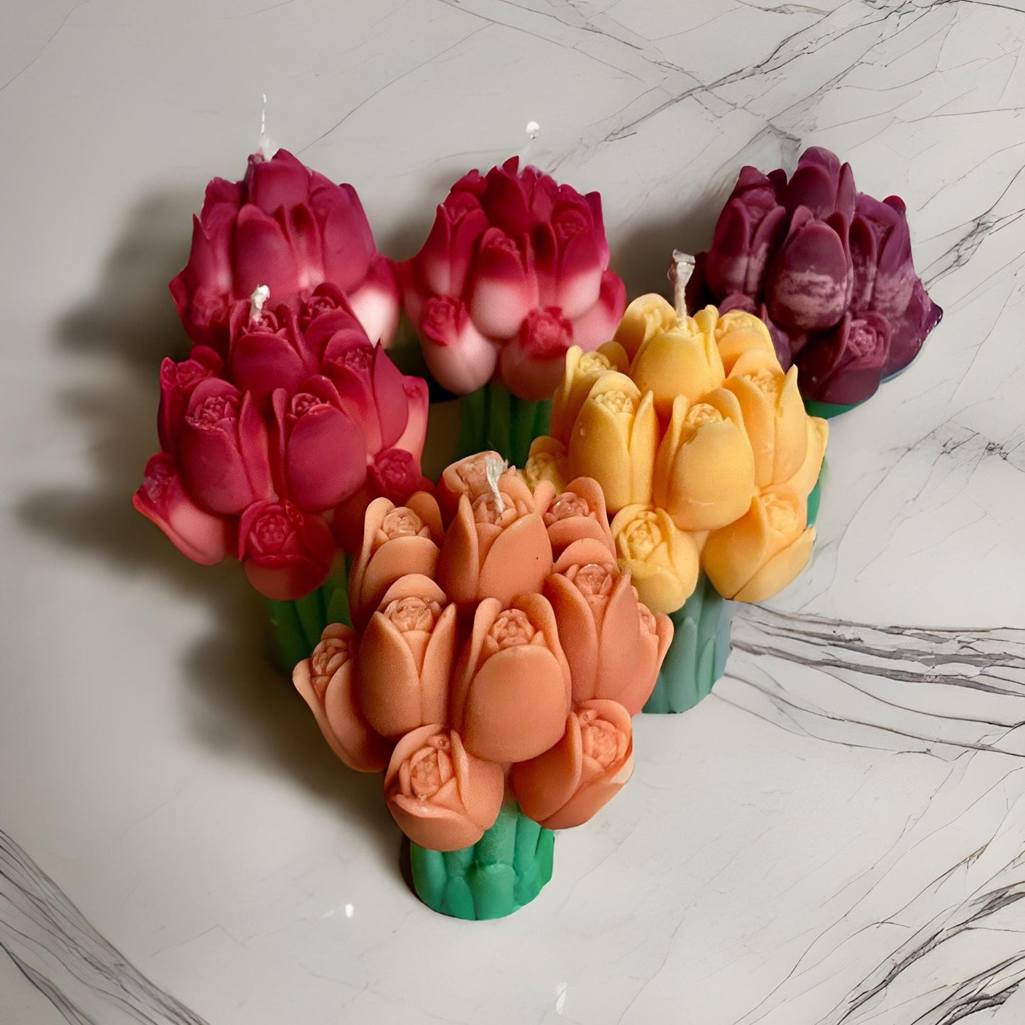 Colorful tulip bouquet candle set by La Bouqe with pink, yellow, purple, and peach flower designs