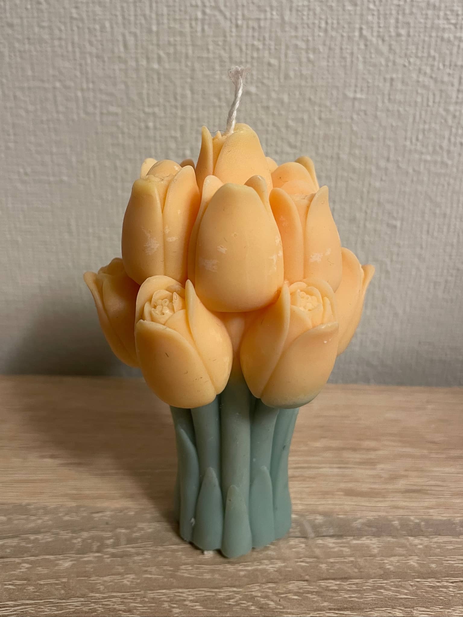 La Bouqe tulip bouquet candle in soft peach and green colors with detailed flower petals