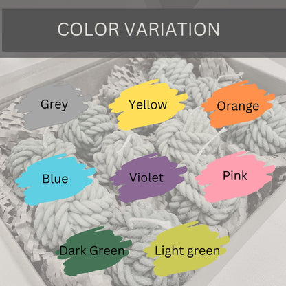 Color variation of yarn ball soy candles by La Bouqe in grey yellow orange blue violet pink dark green and light green