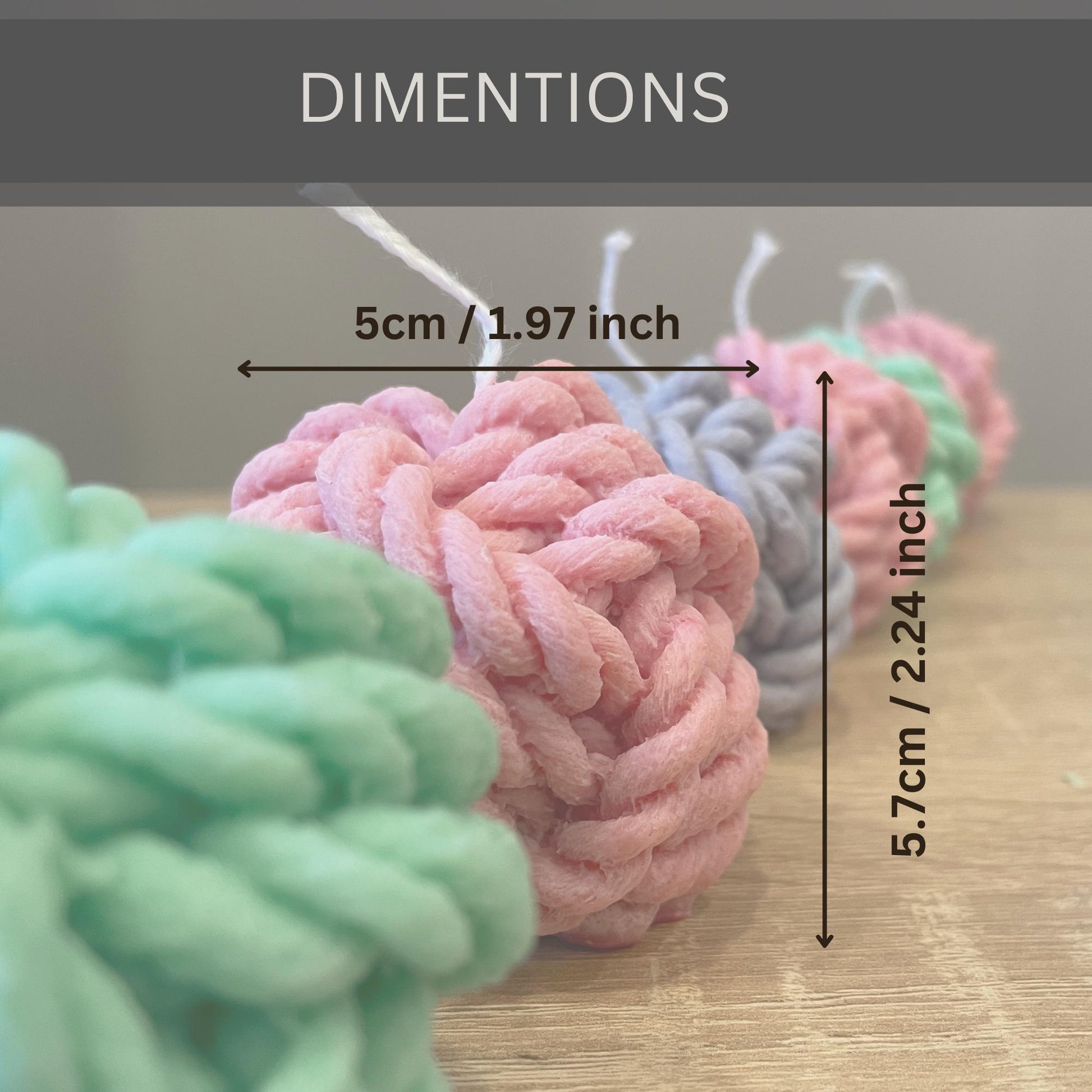 La Bouqe yarn ball soy candles in pastel colors showing dimensions 5cm by 5.7cm on wooden surface